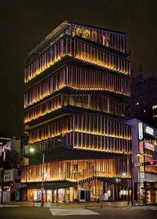 Night view of the Asakusa Culture Tourist Information Center in Tokyo, an eight-story cedar-clad building by Kengo Kuma