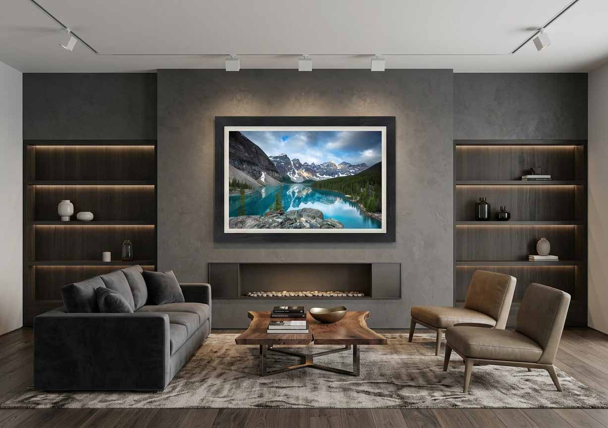 Moraine Lake and the Valley of the Ten Peaks in Banff National Park, framed in charcoal with a white linen liner above a fireplace in a gray sitting room