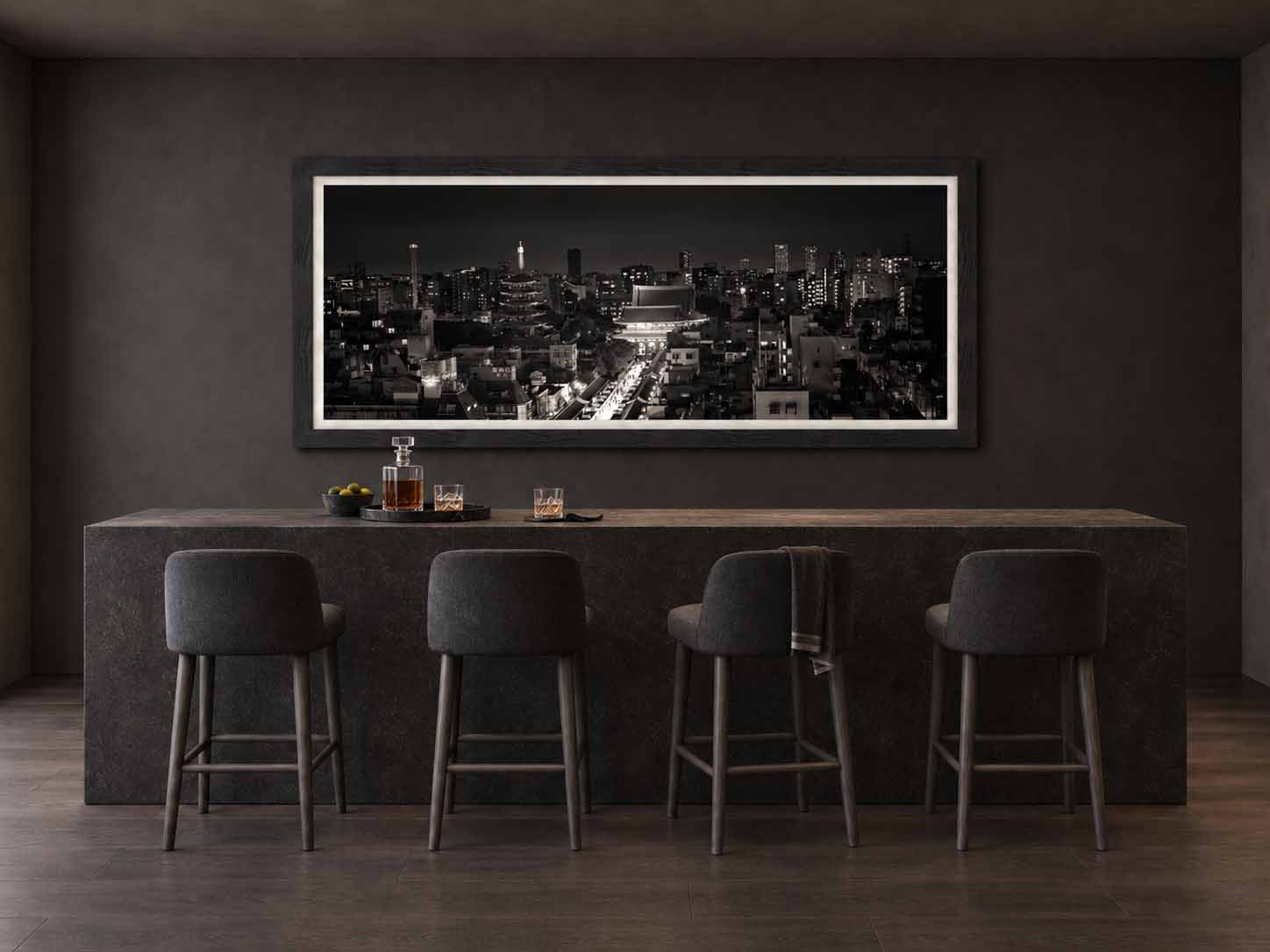 Senso-ji and Nakamise-dori at night in black and white, framed in charcoal with a white linen liner above a stone bar counter in a dark room