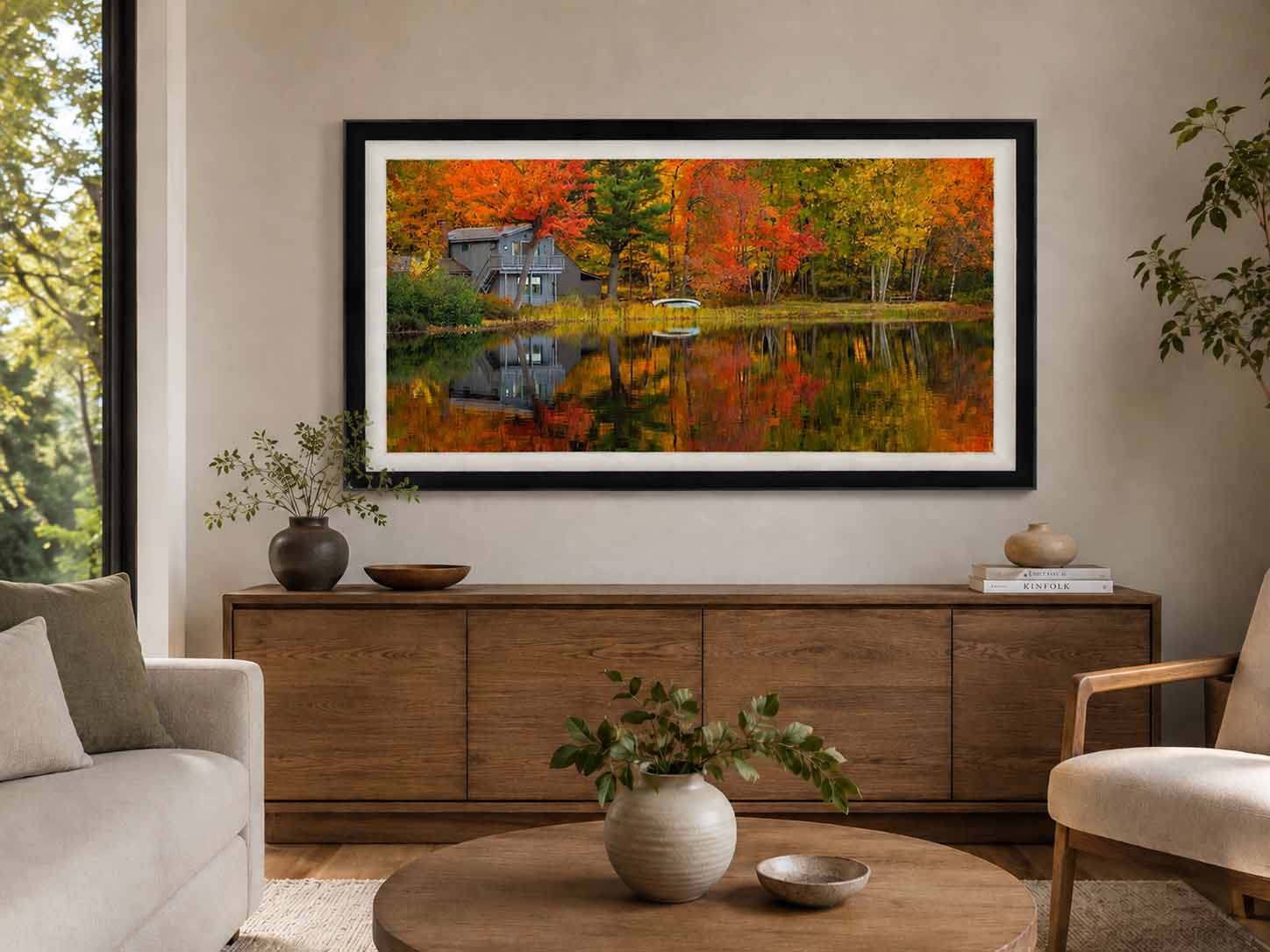 Coming Home shown as a framed print above an oak credenza in a plaster living room, in a Moda Satin Black moulding with a white linen liner
