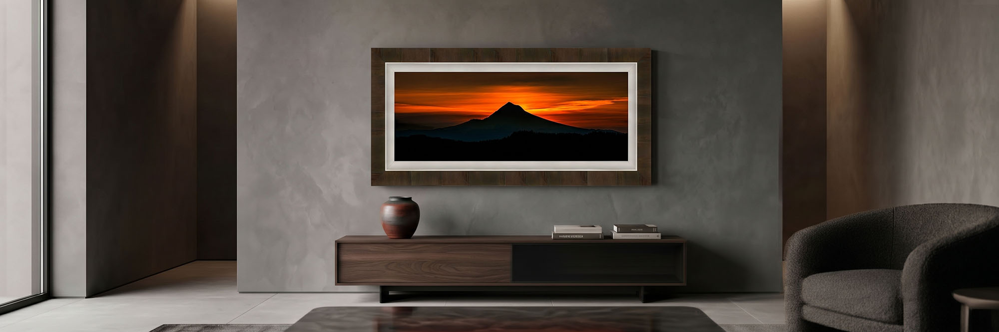 The Hood in Shadow panorama framed above a low walnut console in a dimly lit living room.