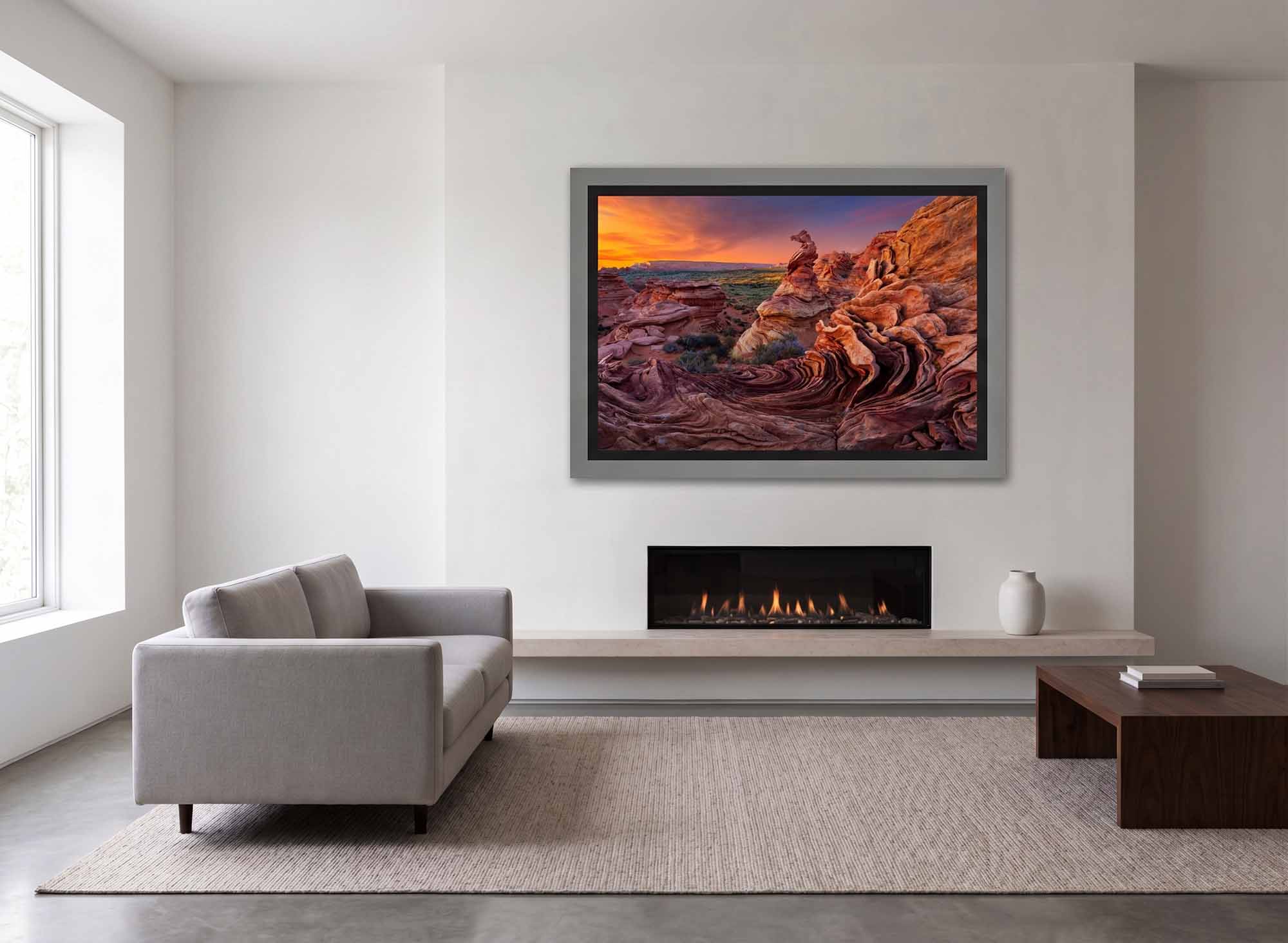 Poseidon in Stone in a Collector's Choice frame with a black linen liner, hanging above a fireplace in a bright living room.