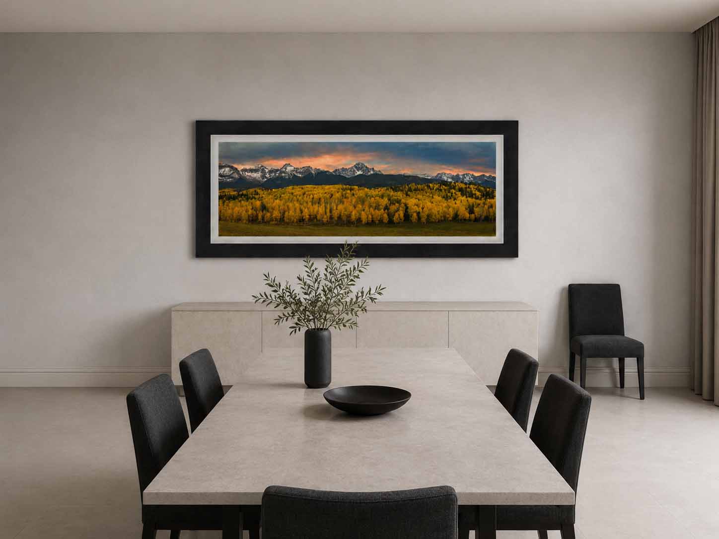 Golden aspen below Mount Sneffels at sunset, framed in dark gray with a white linen liner above a stone sideboard in a quiet dining room.
