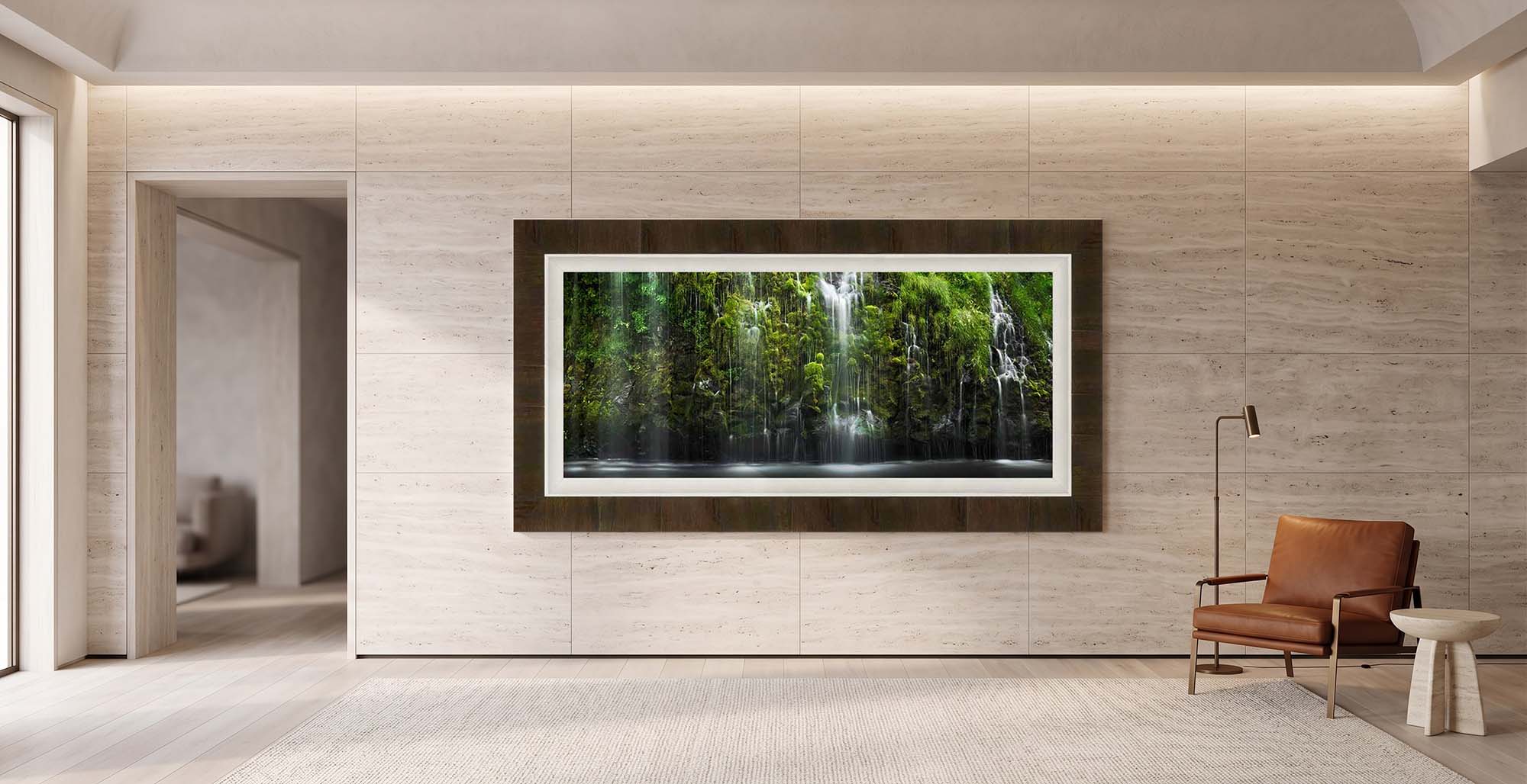 The Quiet Thinker displayed on a honed travertine wall in a contemporary sitting room, framed in Tabacchino Dark Ash with a white linen liner
