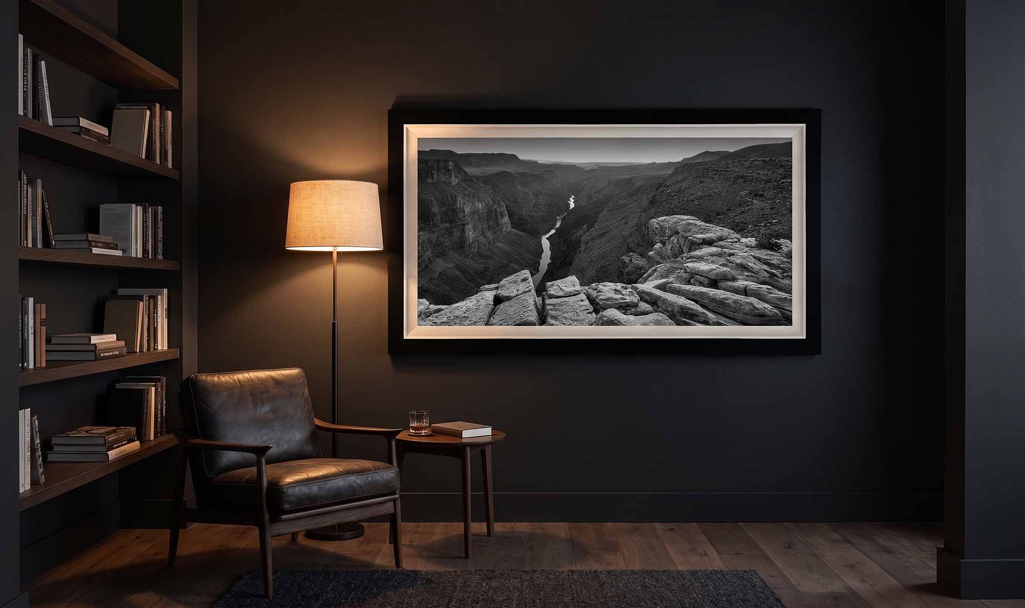 The Serpent's Watch in a Collector's Choice frame with a white linen liner, lit by a floor lamp in a dark home library.