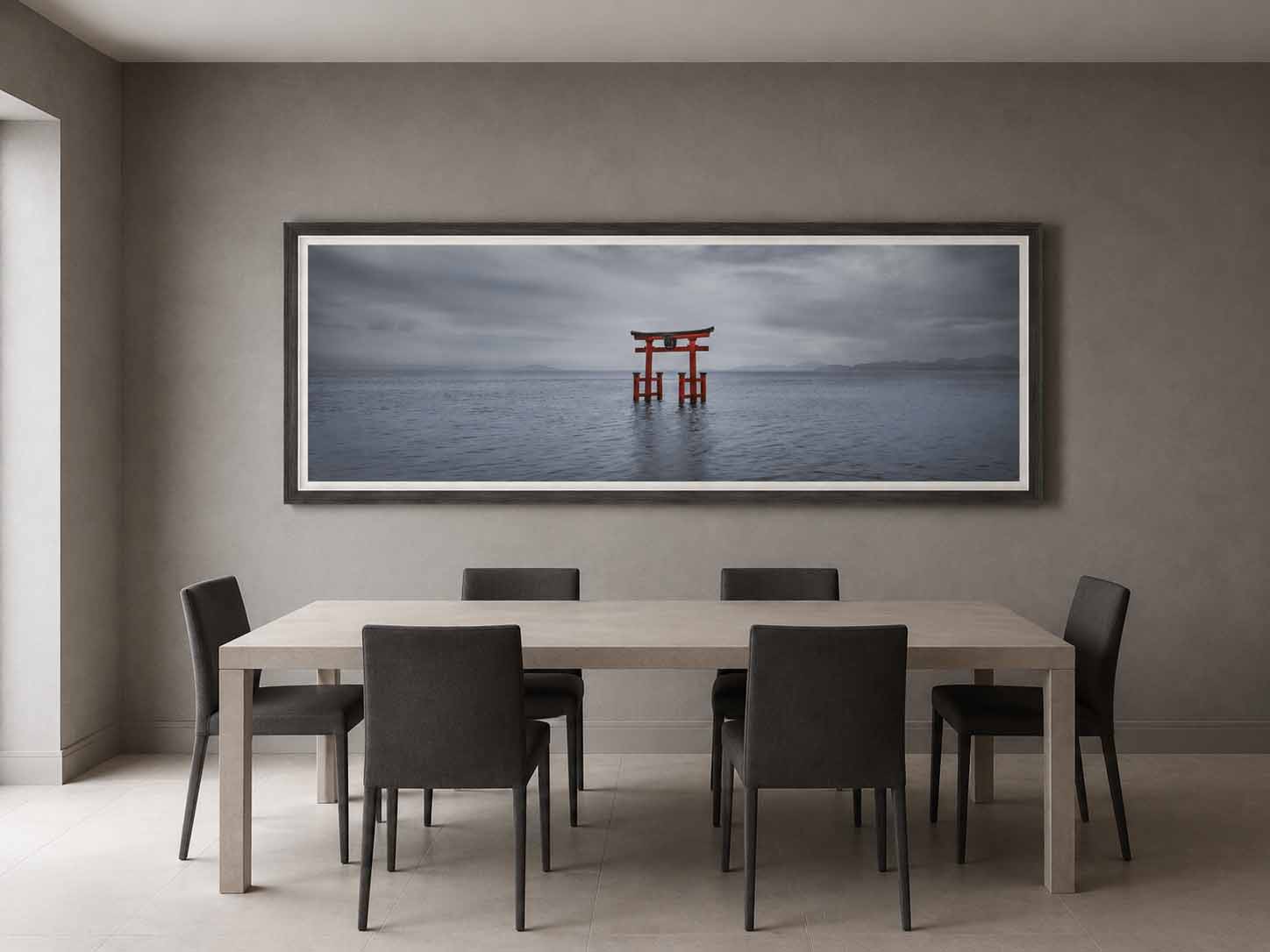 The vermilion torii gate of Shirahige Shrine in Lake Biwa, Japan, framed in gray-brown wood with a white linen liner above a stone table in a quiet dining room.