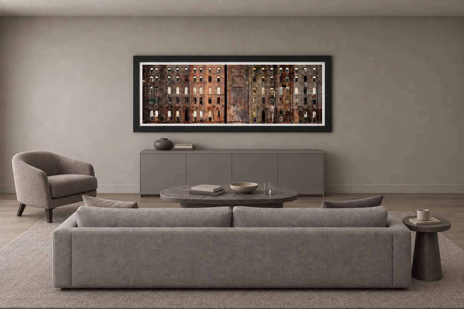 The Domino Sugar Refinery brick facade, framed in black with a white linen liner above a gray console in a warm living room