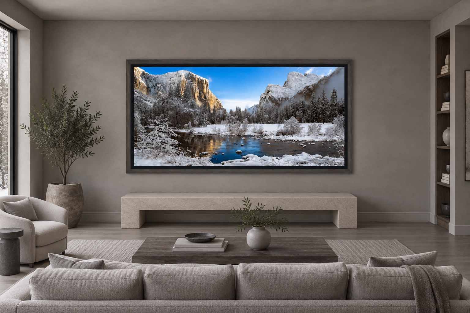 El Capitan and the Merced River after a snowfall at Valley View, framed in gray with a black liner above a limestone bench in a gray sitting room